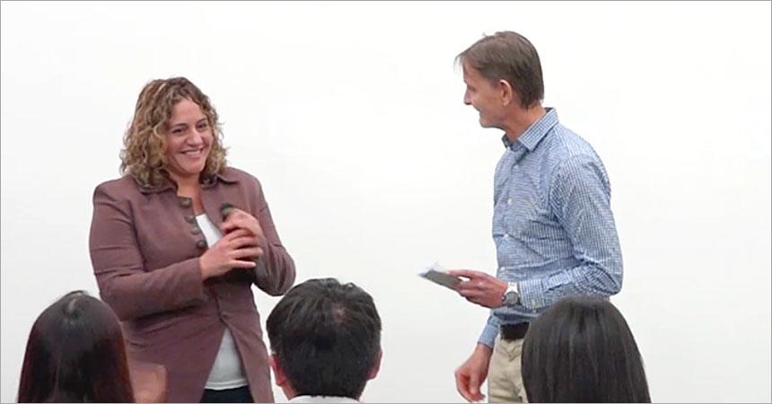  L to R: Rachel Eden, graduate of the Boot Camp for Strategic Planning in Miami this past winter quarter, receives the Derek Parkin Scholarship from Stuart Parkin on March 9, 2018. The $1500 scholarship comes with an additional $500 in career coaching from Sparkin Executive Search, Mr. Parkin’s firm which specializes in guiding strategic planning careers.